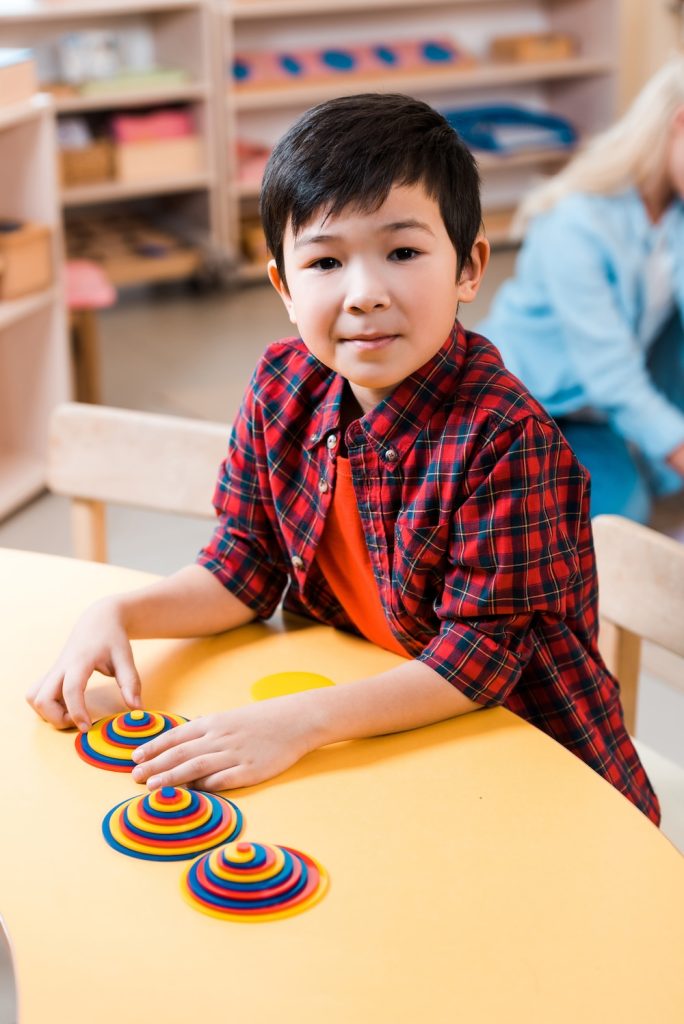 Selective focus of student playing at desk