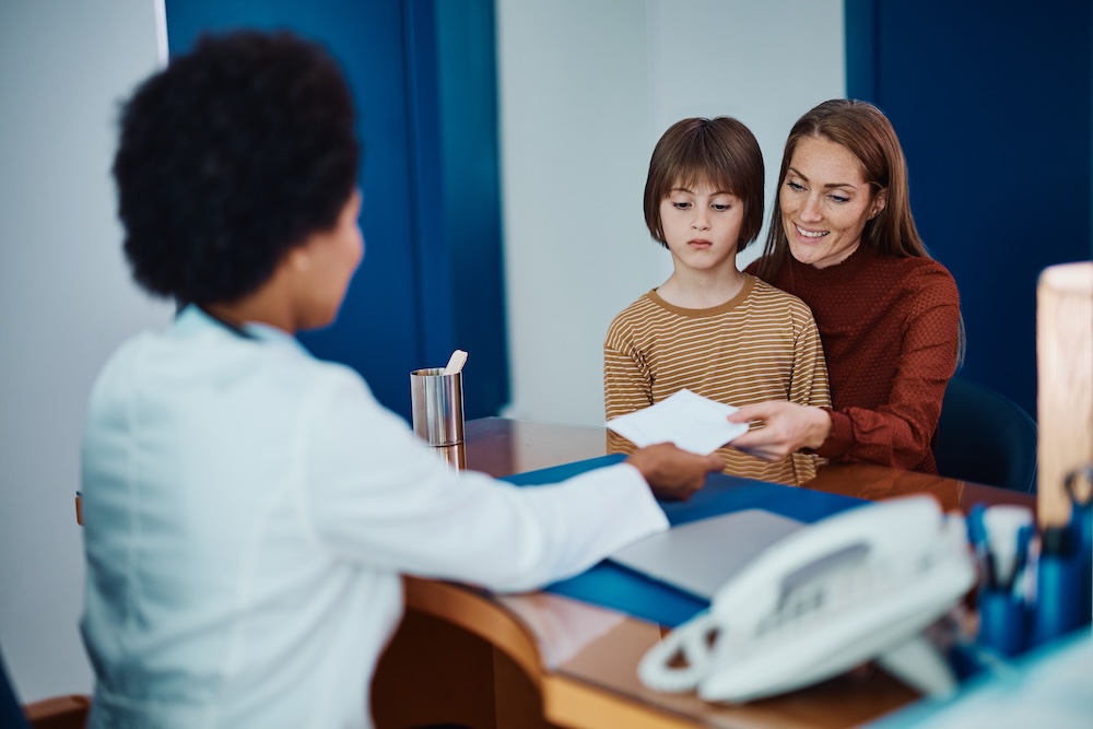 Mother and child meeting with doctor