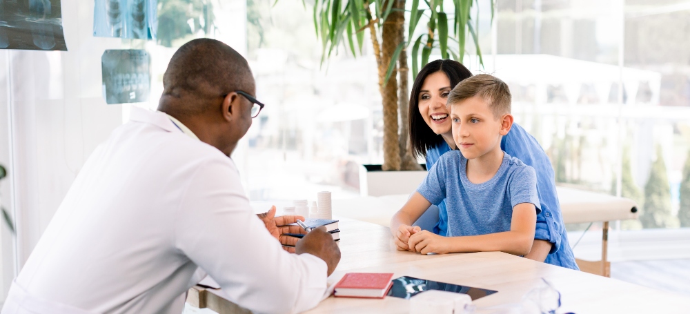 Mother and son in doctors office