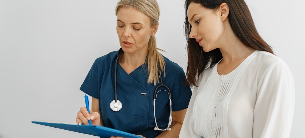 Doctor conducts an assessment with female patient with symptoms of ADHD. 