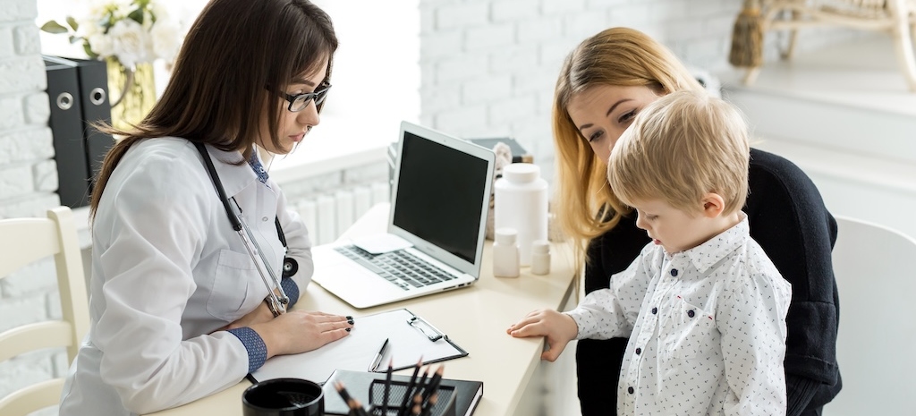 Pediatrician Meeting With Mother And Child In Psych Testing Facility