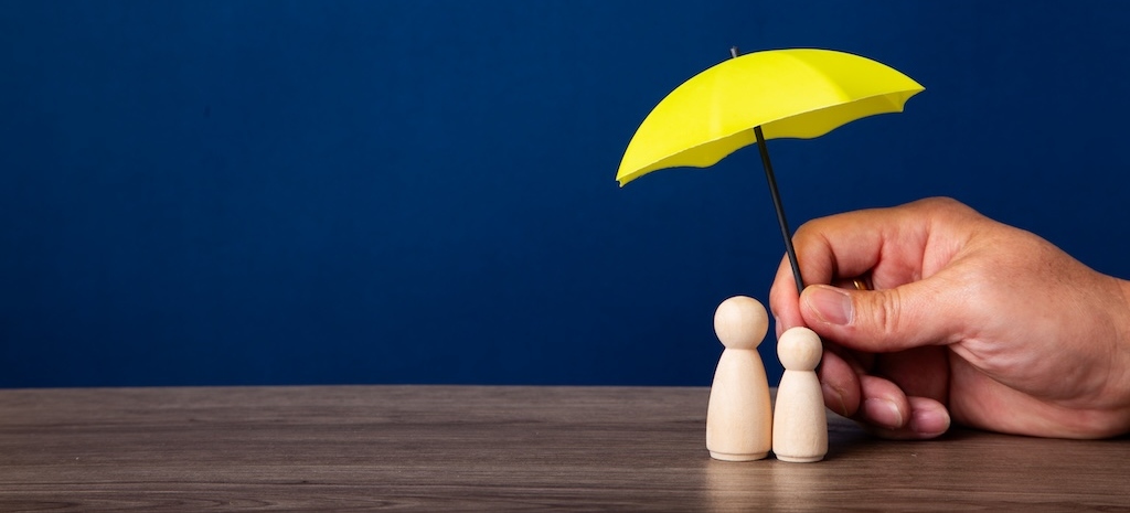 Hand holding umbrella and cover family
