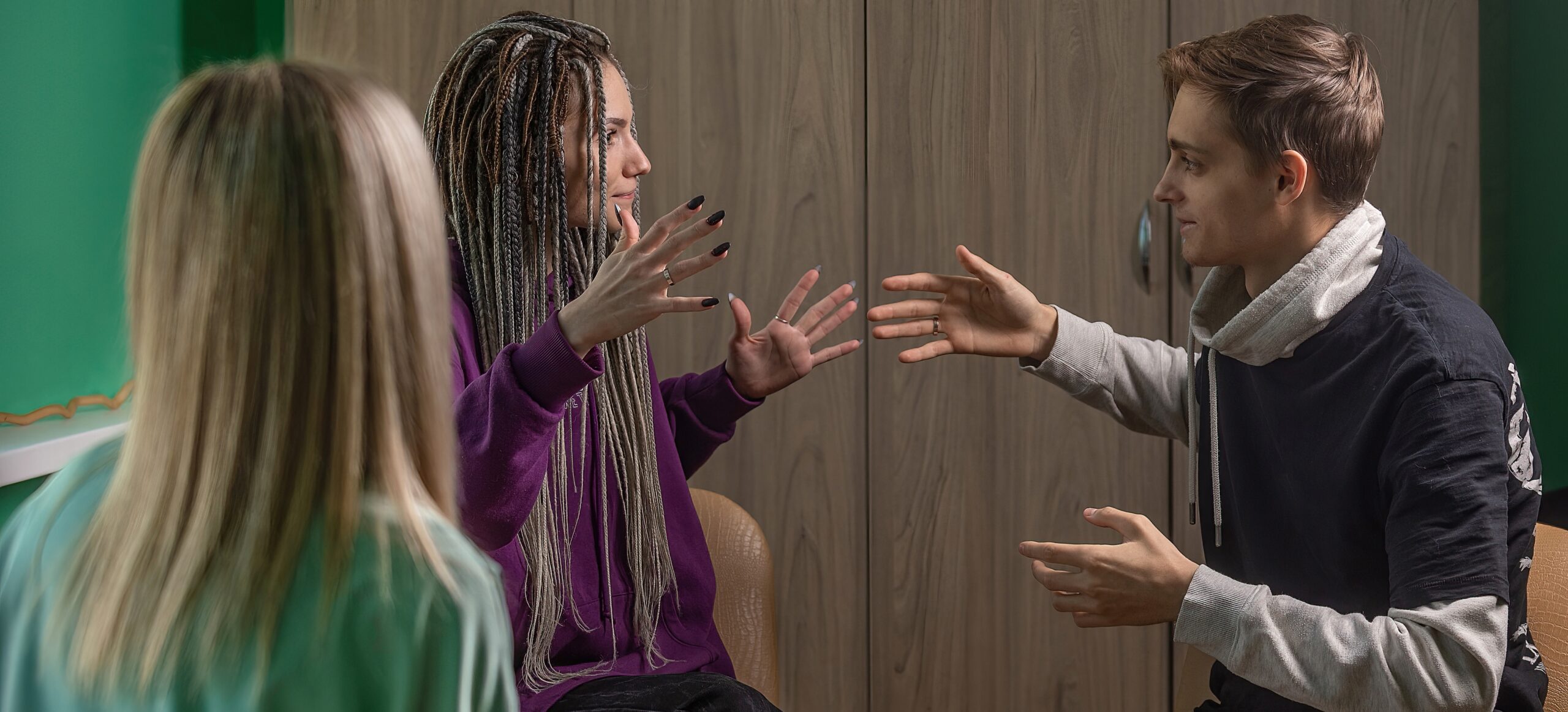 Young people sitting in therapy session