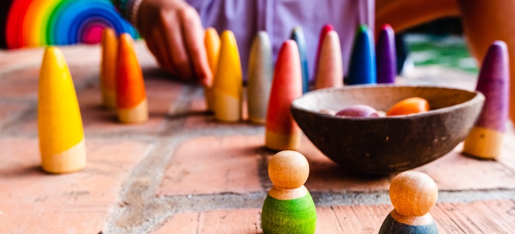 Toys for the unstructured game, made of colored wood to encourage free play.
