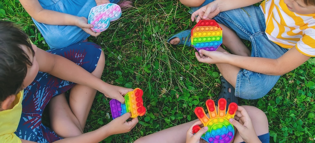 Children playing with stimulatory fidget toys